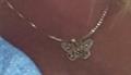 Gold necklace with butterfly charm