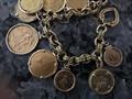 18 kt Gold Charm bracelet with 22kt coin charms